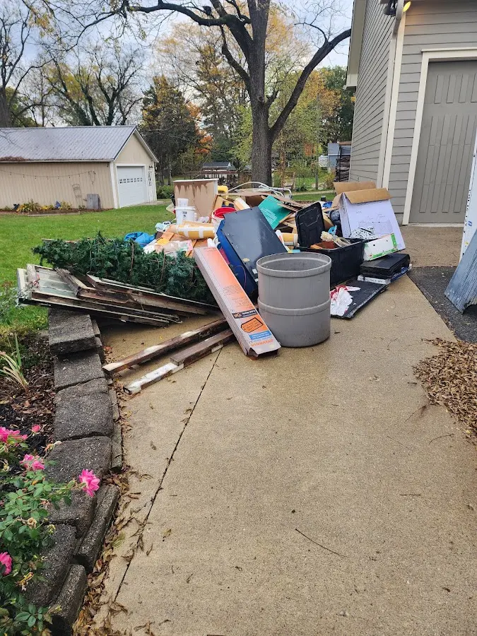 Dumpster being loaded with debris for Demolition Dumpster Rental in Loudon